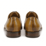 Back view of tan leather lace-up dress shoes