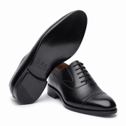 Black leather Oxford shoe sole and side view
