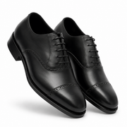 Angled view of black leather Oxford formal shoes