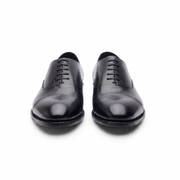 Pair of black leather Oxford dress shoes for men