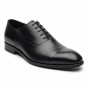 Side view of black leather Oxford dress shoe