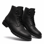 Angled view of black leather ankle boots for men