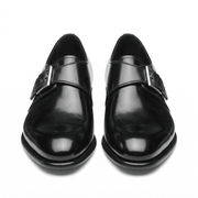 Front view of black patent leather monk strap shoes