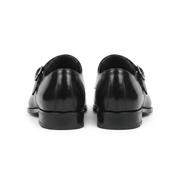 Back view of black patent leather monk strap shoes