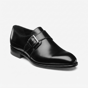 Front angled view of black patent leather monk strap shoes
