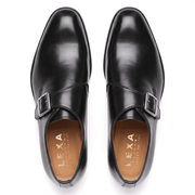 Top view of black patent leather monk strap shoes
