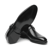Black monk strap shoe showing leather sole