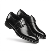 Angled view of black patent leather monk strap shoes