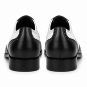 Rear view of black and white leather brogue shoes