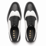 Top view of black and white leather brogue shoes for men