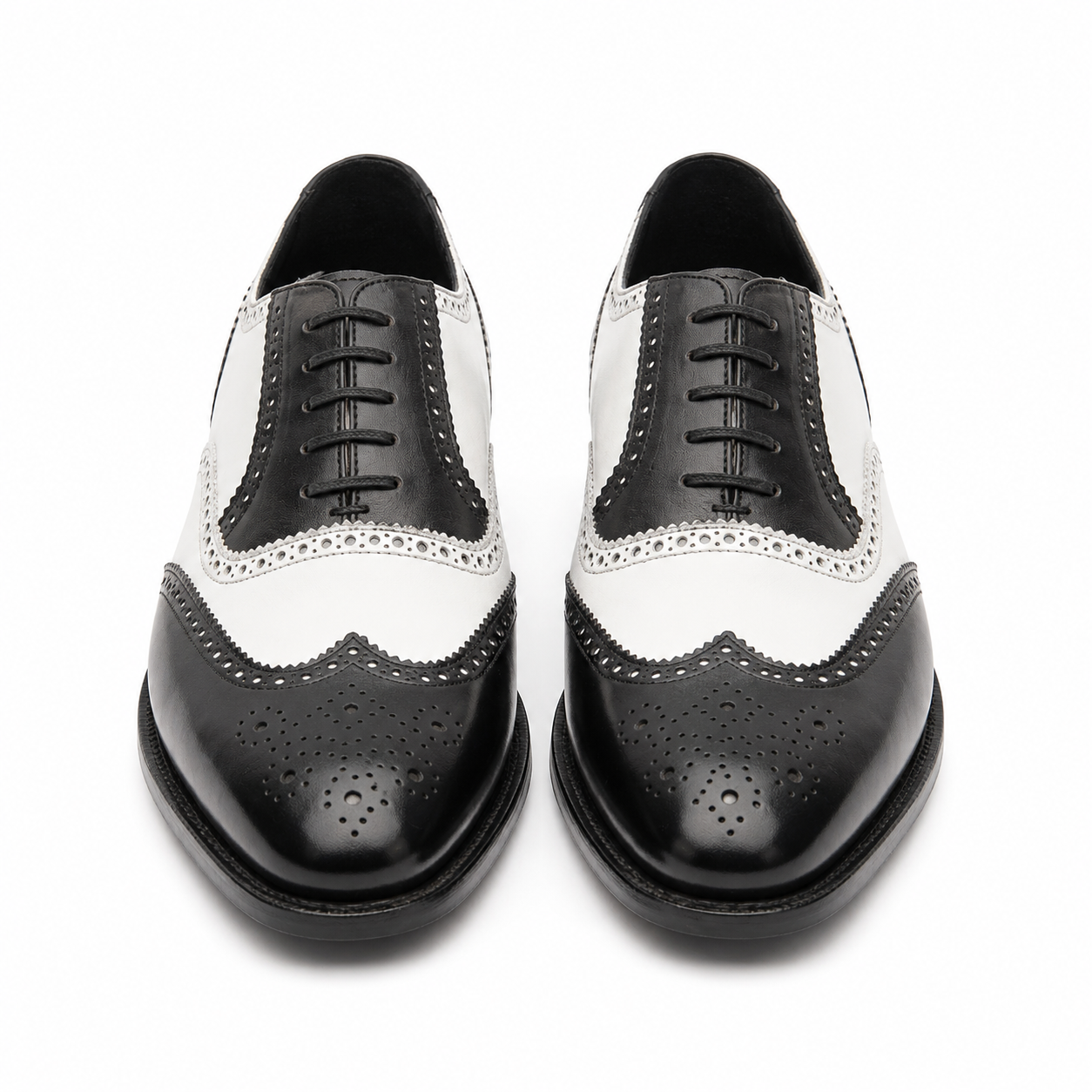 Front view of black and white leather brogue shoes for men