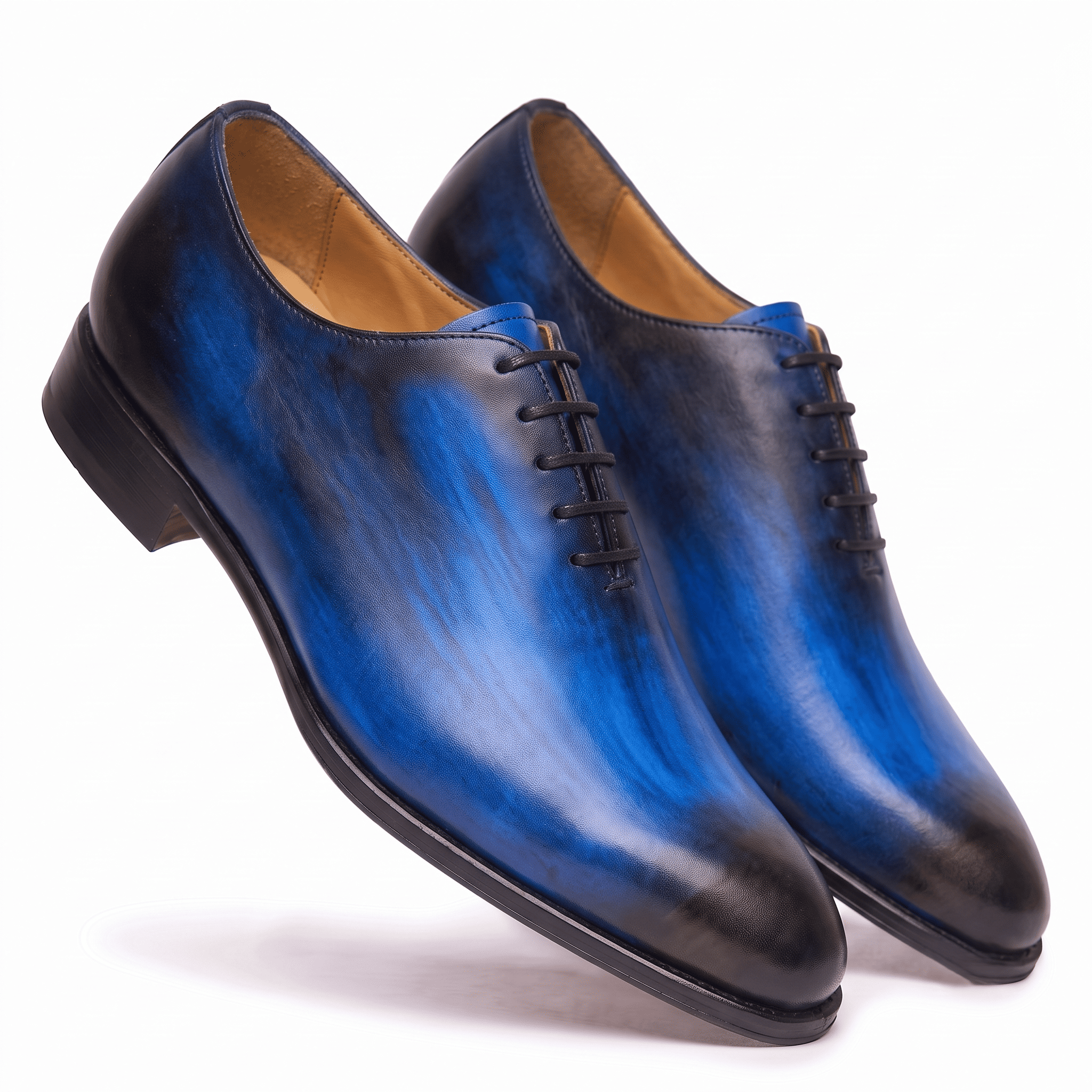 Angled view of blue leather Oxford shoes showing the soles