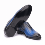 Side profile of blue leather Oxford dress shoe