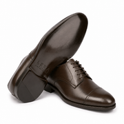 Angled view of dark brown leather Derby shoe showing the sole
