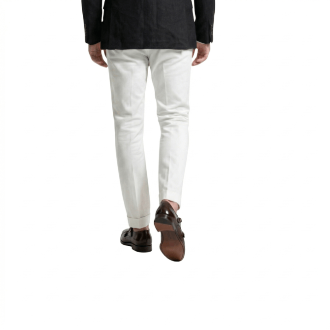 Back view of men wearing brown double monk strap shoes with cream trousers and black blazer formal outfit style