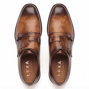 Pair of brown leather double monk strap shoes viewed from above