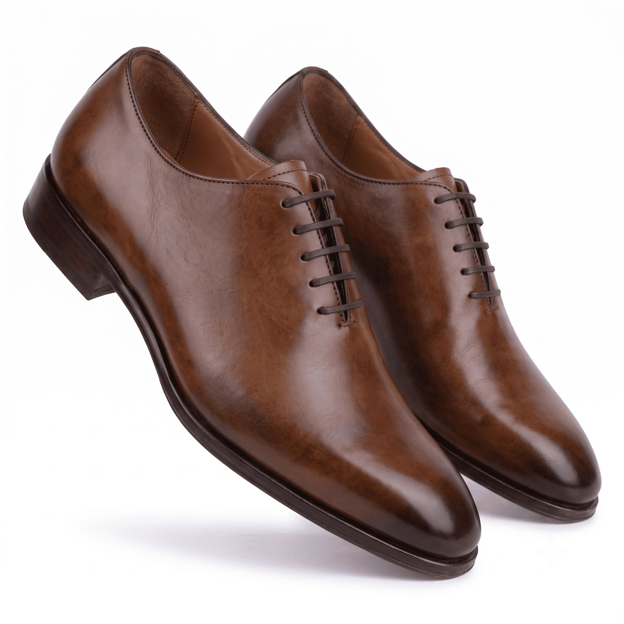 Pair of brown leather Oxford shoes showing side profile