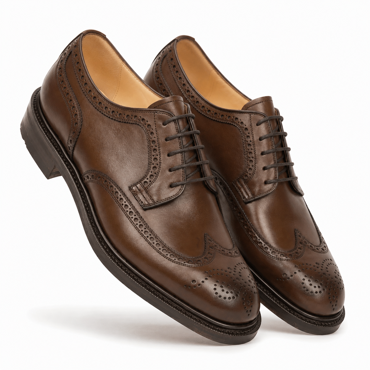 Pair of brown leather Derby shoes in angled view
