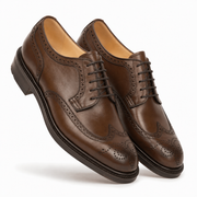 Pair of brown leather Derby shoes in angled view