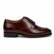 Side profile of dark brown leather Oxford dress shoe