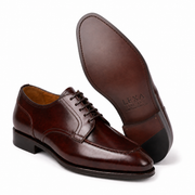 Dark brown leather Oxford shoe showing the sole and construction