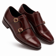 Three-quarter view of dark brown leather double monk strap shoes