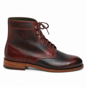 Side profile of dark brown leather lace-up ankle boots