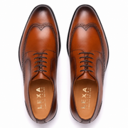 Pair of brown men's Oxford shoes viewed from above