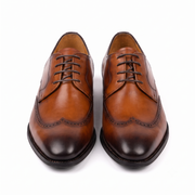 Pair of brown men's Oxford shoes front view