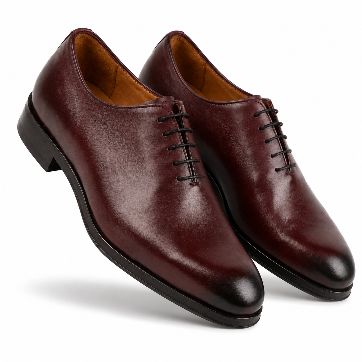 Pair of brown leather Oxford shoes shown from an angled view