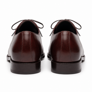 Rear view of brown leather Oxford shoes showing heel design