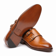 Bottom view of men's tan brown double monk strap leather shoes