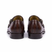 Pair of dark brown leather double monk strap shoes rear view