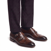 Dark brown double monk strap shoes worn with formal trousers