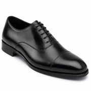 Side view of black leather dress shoe