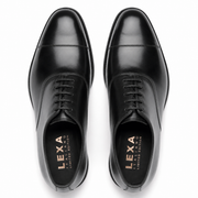 Top view of black leather dress shoes for men