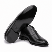 Bottom sole view of black leather dress shoe