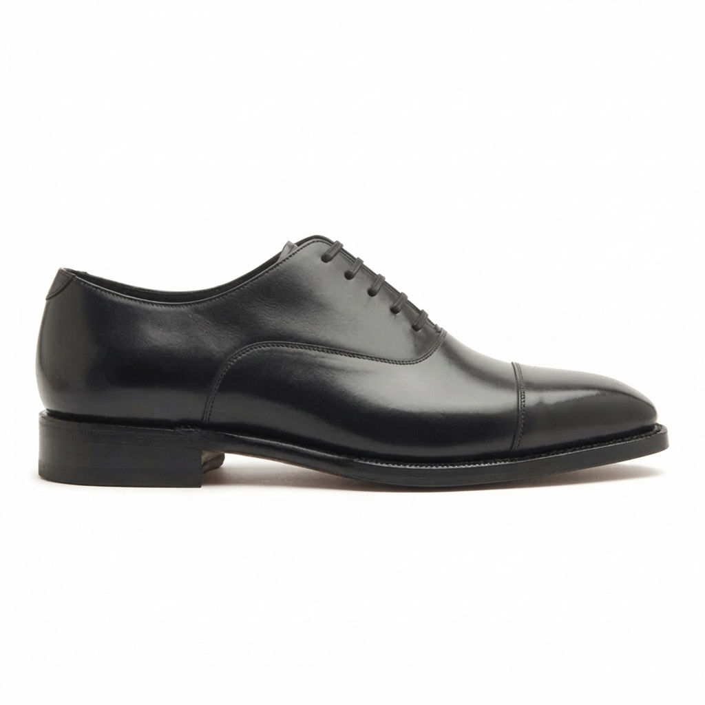 Black leather dress shoe side profile