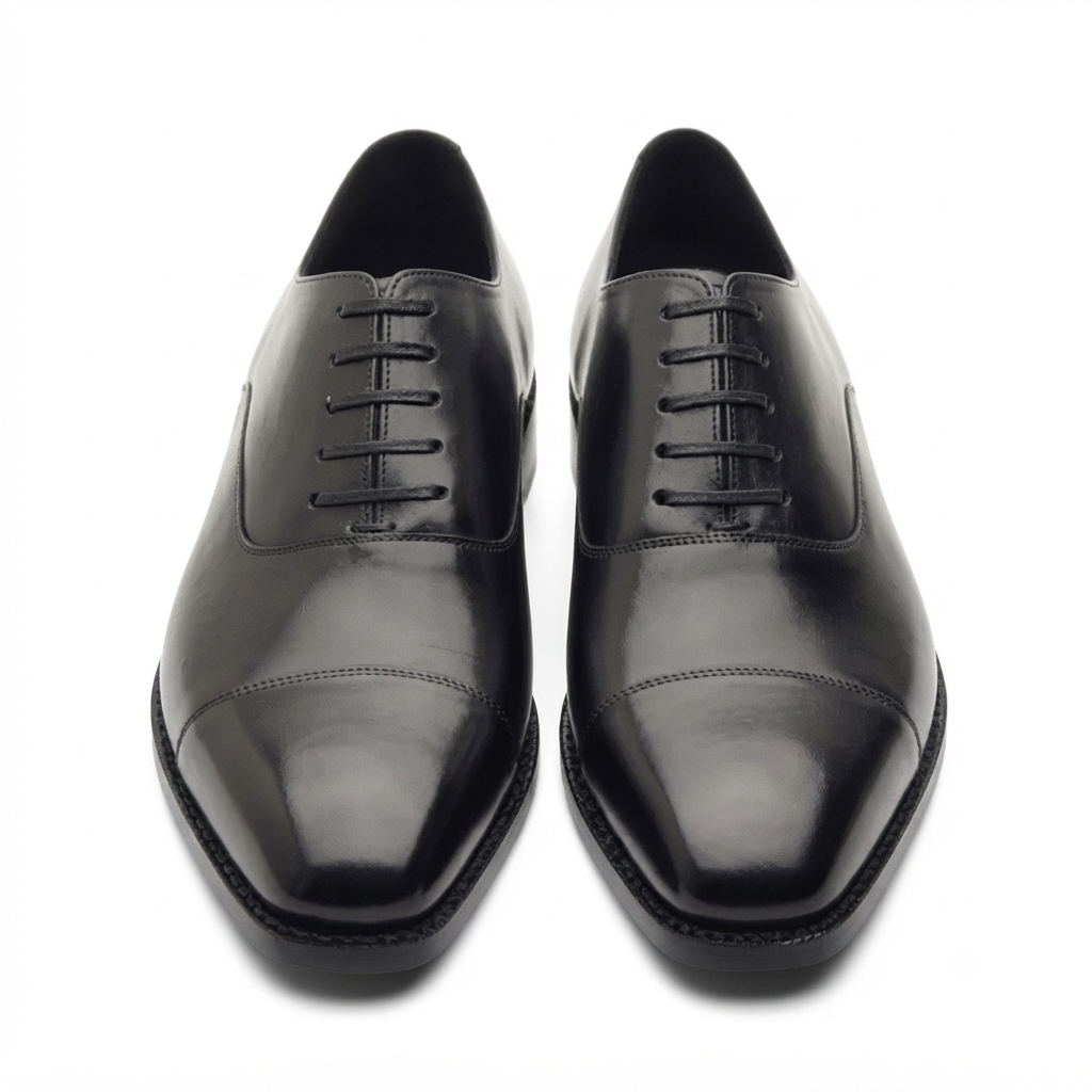 Front view of black leather dress shoes for men