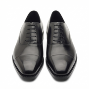 Front view of black leather dress shoes for men