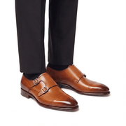 Brown double monk strap shoes worn with formal trousers