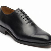 Side view of black leather Oxford dress shoes