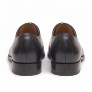 Rear view of black leather Oxford shoes showing heel detail