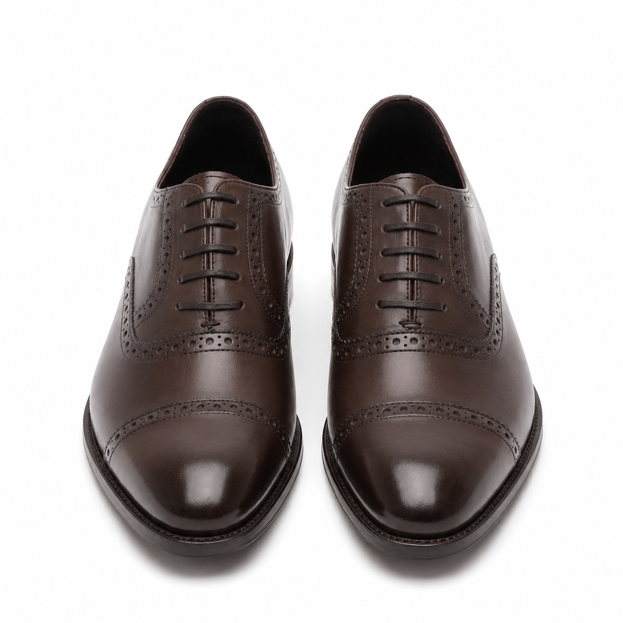Dark brown leather Oxford shoes showing the outsole and heel design