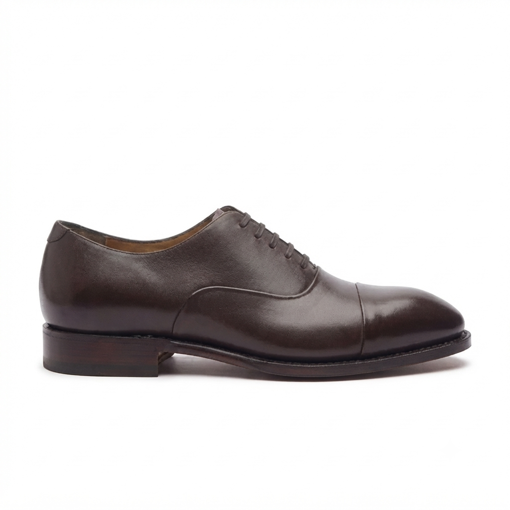 Side profile of brown leather Oxford dress shoe