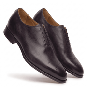 Dark brown leather lace-up dress shoes three-quarter view