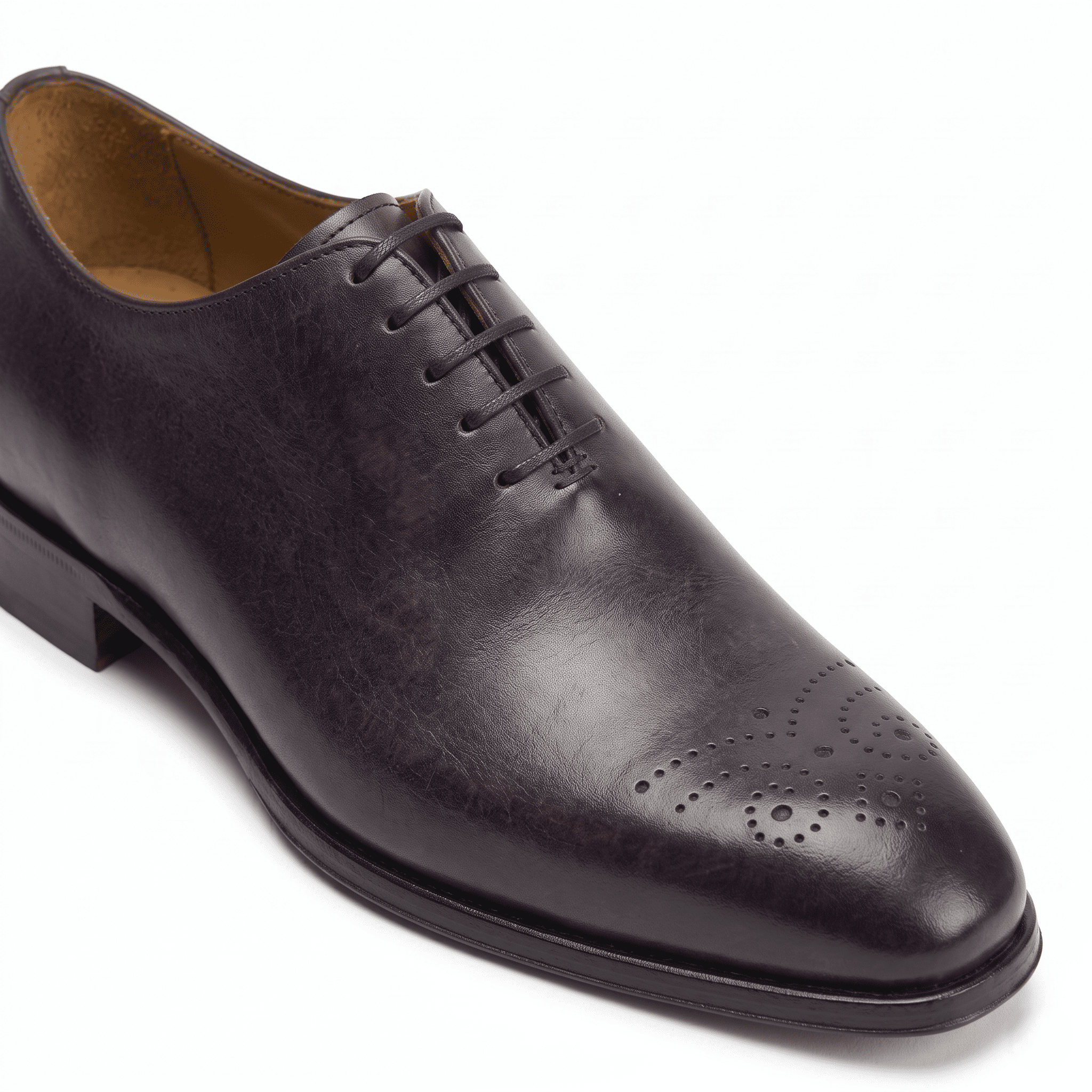 Side view of dark brown leather lace-up dress shoe