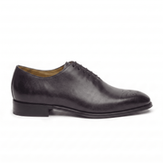 Side profile of dark brown leather lace-up dress shoe