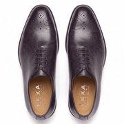 Top view of dark brown leather lace-up dress shoes