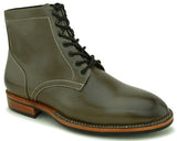 Side view of forest green Goodyear-welted boots showcasing durable build and solid sole